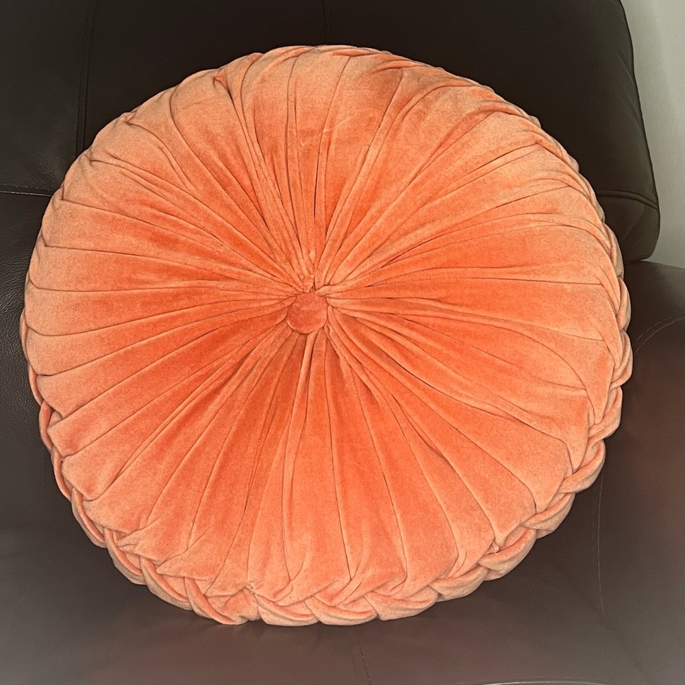 Coral colored accent pillow